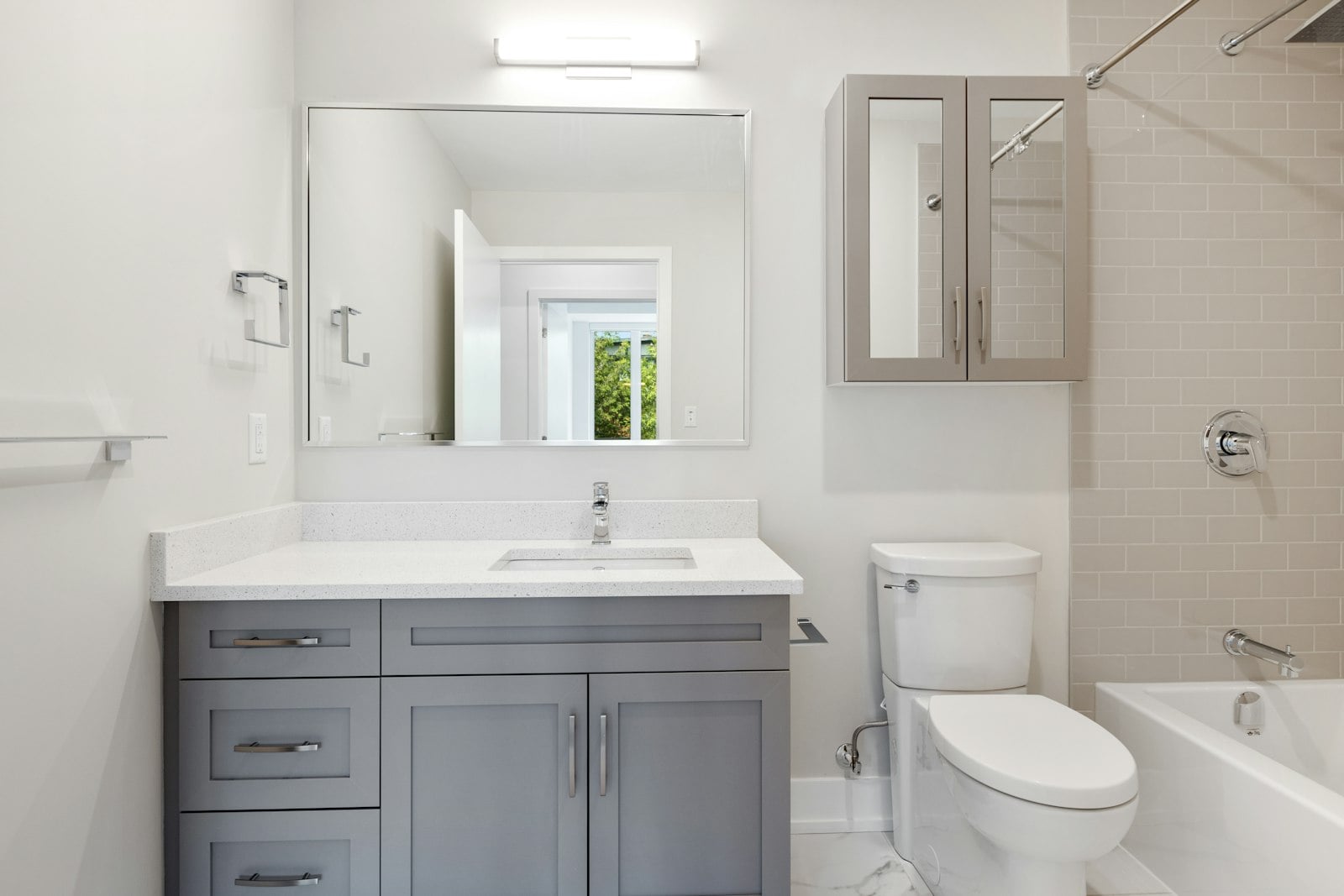 Bathroom with vanity sink, toilet and bathtub