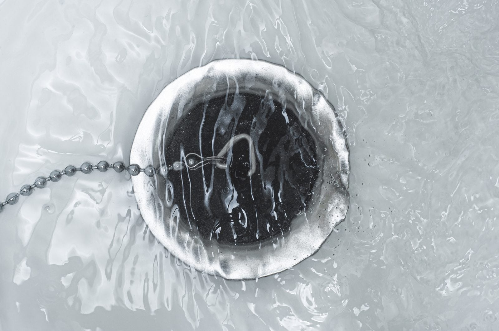 Bathtub drain covered by a rubber stopper underwater